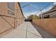 Long driveway with potential RV access behind secure gates at 7621 Gosport Ave, Las Vegas, NV 89131