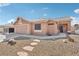 Charming single-story home with low-maintenance desert landscaping, stepping stones and two car garage at 7621 Gosport Ave, Las Vegas, NV 89131