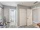 Hallway with several open doors and a double-door closet that provides ample storage space at 7621 Gosport Ave, Las Vegas, NV 89131