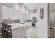 Modern kitchen with white cabinets, quartz countertops, and stainless steel appliances at 7621 Gosport Ave, Las Vegas, NV 89131