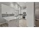 Modern kitchen features marble countertops, stainless steel appliances, and white cabinetry at 7621 Gosport Ave, Las Vegas, NV 89131