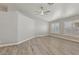 Comfortable living room featuring wood-style flooring, plantation shutters, and recessed lighting at 7621 Gosport Ave, Las Vegas, NV 89131