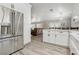 Open layout from kitchen to living room, with wood floors throughout at 7621 Gosport Ave, Las Vegas, NV 89131