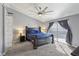 Bright main bedroom with king bed, modern ceiling fan, and sliding glass door to the backyard at 7621 Gosport Ave, Las Vegas, NV 89131