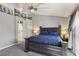 Spacious main bedroom with king bed, en suite bathroom, and large modern ceiling fan at 7621 Gosport Ave, Las Vegas, NV 89131