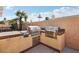 Well-equipped outdoor kitchen featuring a built-in grill and countertops at 7621 Gosport Ave, Las Vegas, NV 89131