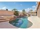 Backyard pool showcasing rock waterfall feature, tiled steps, and ample patio space for outdoor enjoyment at 7621 Gosport Ave, Las Vegas, NV 89131