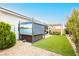 Relaxing backyard with hot tub, covered patio, and artificial turf for easy maintenance and outdoor fun at 856 Watford Pl, Henderson, NV 89011