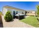 Well-manicured backyard with a hot tub, low-maintenance landscaping and a covered patio area at 856 Watford Pl, Henderson, NV 89011