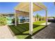 Backyard featuring artificial turf, patio with pergola, and a hot tub at 856 Watford Pl, Henderson, NV 89011