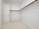 Bright walk-in closet with neutral carpet and white walls, ready for organization at 856 Watford Pl, Henderson, NV 89011