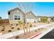 Stylish single-story home featuring a three-car garage and desert-friendly landscaping at 856 Watford Pl, Henderson, NV 89011