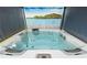 Luxurious hot tub featuring multiple jets and controls providing ultimate relaxation and hydrotherapy benefits at 856 Watford Pl, Henderson, NV 89011