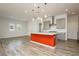 Open kitchen design featuring an island with sleek, white countertops and modern pendant lighting at 856 Watford Pl, Henderson, NV 89011