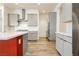 The kitchen is complete with sleek grey cabinets, stainless steel appliances, and a bold, colorful island at 856 Watford Pl, Henderson, NV 89011