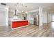 Modern kitchen boasts gray cabinets, stainless steel appliances, and a large island with pendant lighting at 856 Watford Pl, Henderson, NV 89011