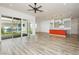 Bright living room showcasing tile floors, sliding glass doors to the patio, and an open floor plan at 856 Watford Pl, Henderson, NV 89011