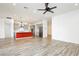 Open-concept living space with a modern kitchen island, stainless steel appliances, and recessed lighting at 856 Watford Pl, Henderson, NV 89011