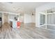 Open-concept living space with modern kitchen, dining area, and light wood flooring at 856 Watford Pl, Henderson, NV 89011