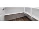 Organized pantry with built-in white shelving and wood flooring for convenient storage at 856 Watford Pl, Henderson, NV 89011