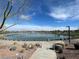 Scenic view of a tranquil pond with lush greenery and a walking path at 856 Watford Pl, Henderson, NV 89011