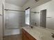 Well-maintained bathroom with double sinks, a large mirror, and a shower-tub combo at 8680 Horizon Wind Ave # 101, Las Vegas, NV 89178