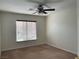 Simple bedroom with neutral walls, plush carpeting, and a ceiling fan for added comfort at 8680 Horizon Wind Ave # 101, Las Vegas, NV 89178