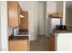 Bright kitchen with wooden cabinets, essential appliances, and practical countertop space at 8680 Horizon Wind Ave # 101, Las Vegas, NV 89178