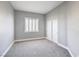 Bedroom features neutral walls, carpet flooring, a window with blinds, and a closet with double doors at 8864 La Manga Ave, Las Vegas, NV 89147