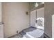Close-up of the elegant double front doors with an overhead window and outdoor lighting at 8864 La Manga Ave, Las Vegas, NV 89147