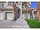 Inviting front entrance with manicured lawn and palm trees leading to the double-door entry at 8864 La Manga Ave, Las Vegas, NV 89147