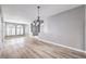 Open floor plan shows hardwood floors, gray walls, and arched windows at 8864 La Manga Ave, Las Vegas, NV 89147