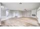 Spacious living room features light wood floors and neutral paint palette at 8864 La Manga Ave, Las Vegas, NV 89147