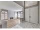 Open-concept living area with a fireplace, arched windows, and sleek flooring at 8864 La Manga Ave, Las Vegas, NV 89147