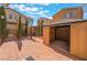 Private backyard with a brick patio and desert landscaping at 9071 Mount Wilson St, Las Vegas, NV 89113