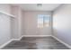 Vacant bedroom with a large window offering neighborhood views and a storage closet at 9071 Mount Wilson St, Las Vegas, NV 89113