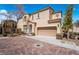 Inviting two-story home with a red-tile roof and a two-car garage in a well-maintained neighborhood at 9071 Mount Wilson St, Las Vegas, NV 89113