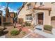 Charming home exterior showcasing a landscaped front yard, brick walkway, and welcoming entrance at 9071 Mount Wilson St, Las Vegas, NV 89113