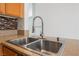 A close up of the kitchen sink with stainless steel appliances at 9071 Mount Wilson St, Las Vegas, NV 89113