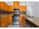 Stylish kitchen features wood cabinets and stainless steel appliances at 9071 Mount Wilson St, Las Vegas, NV 89113