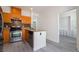 Well-lit kitchen boasts wood cabinets and stainless steel appliances at 9071 Mount Wilson St, Las Vegas, NV 89113