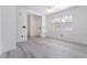Bright living room features modern gray flooring and a ceiling fan at 9071 Mount Wilson St, Las Vegas, NV 89113