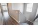 Stairway with gray wood-style flooring and a bright window on the second floor at 9071 Mount Wilson St, Las Vegas, NV 89113