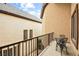 Balcony features an iron railing and chairs, offering a relaxing place to unwind outdoors at 9172 Tudor Park Pl, Las Vegas, NV 89145
