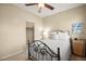 Cozy bedroom features decorative accents, neutral walls, and a comfy bed at 9172 Tudor Park Pl, Las Vegas, NV 89145