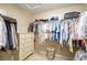 Walk-in closet provides plenty of storage with built-in shelving and drawers at 9172 Tudor Park Pl, Las Vegas, NV 89145