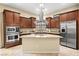 Spacious kitchen boasts granite countertops, stainless steel appliances, and ample cabinet space at 9172 Tudor Park Pl, Las Vegas, NV 89145