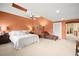 Large main bedroom with plush carpet, a ceiling fan, and neutral paint for a relaxing space at 9172 Tudor Park Pl, Las Vegas, NV 89145