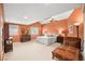 Spacious main bedroom with soft carpet, seating area, and large windows for natural light at 9172 Tudor Park Pl, Las Vegas, NV 89145