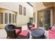 Secluded patio featuring comfortable seating and charming brick design at 9172 Tudor Park Pl, Las Vegas, NV 89145